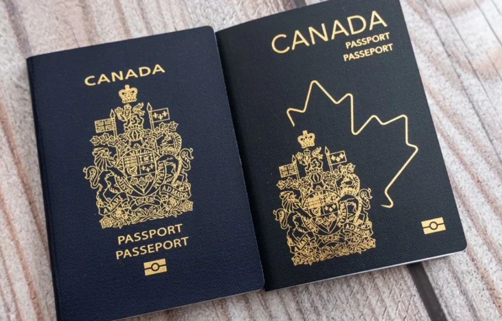 the-2013-version-of-the-canadian-passport-beside-the-2023-updated-version-of-the-canadian-passport-on-a-wooden-table